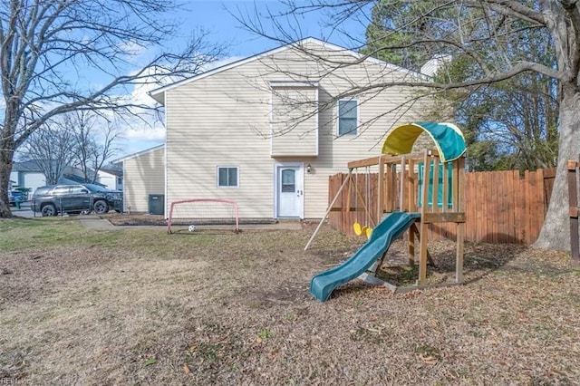 view of jungle gym featuring fence