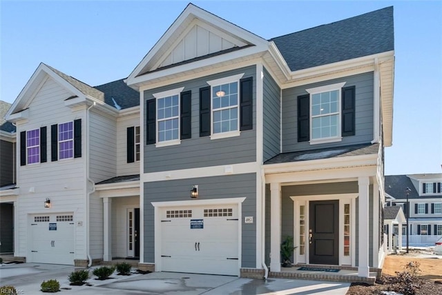 view of front facade featuring board and batten siding, concrete driveway, a shingled roof, and an attached garage