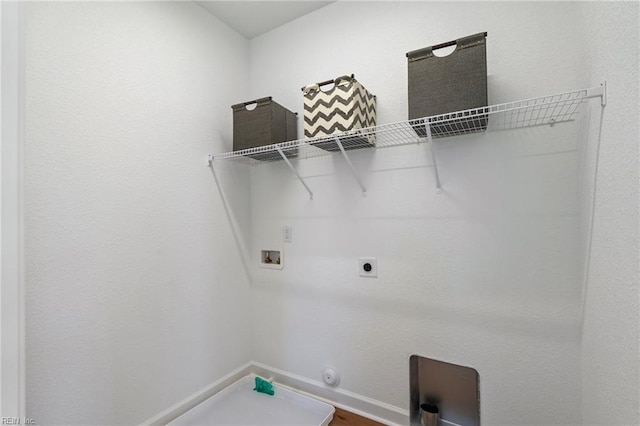 clothes washing area with gas dryer hookup, laundry area, washer hookup, and hookup for an electric dryer