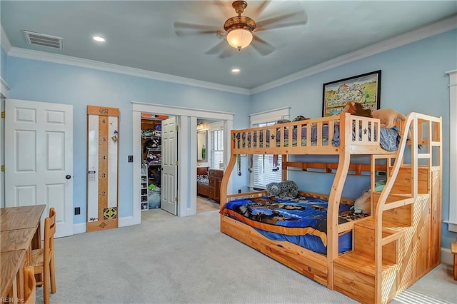 bedroom featuring baseboards, visible vents, crown molding, and carpet flooring