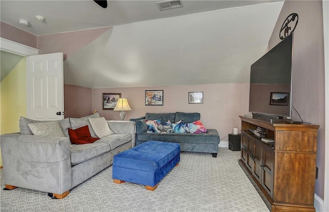 living room with light carpet, baseboards, visible vents, and vaulted ceiling