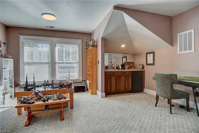 interior space featuring light carpet, baseboards, and visible vents