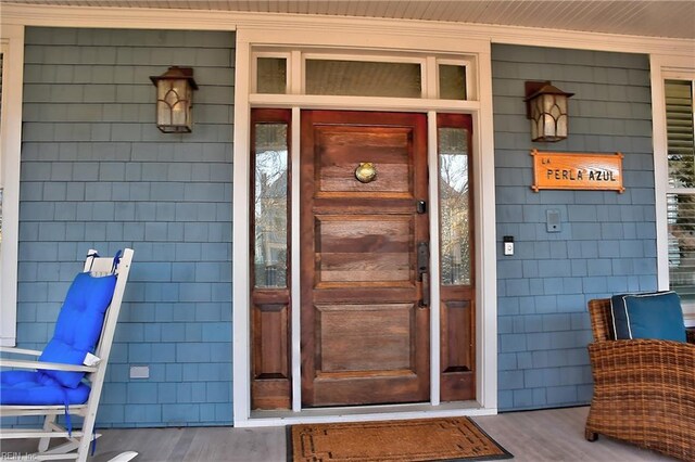 entrance to property with a porch