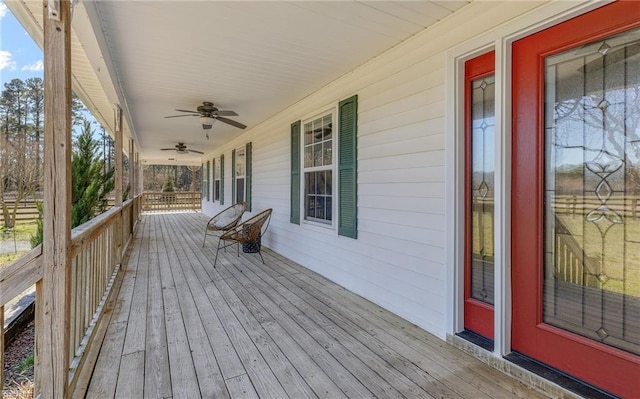 wooden deck with a ceiling fan and a porch