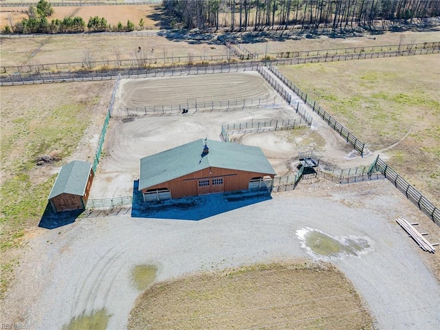 birds eye view of property with a rural view