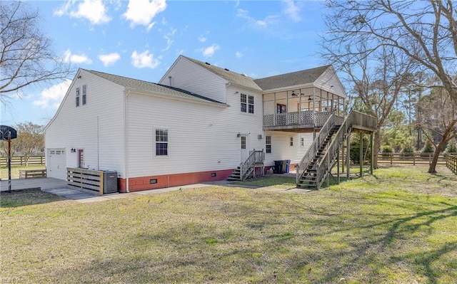 rear view of house with a lawn, crawl space, fence, a garage, and stairs