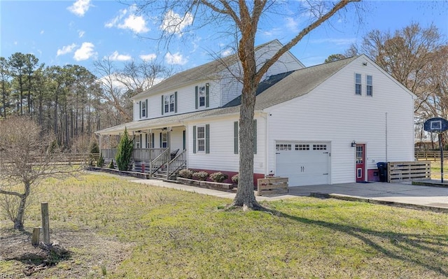 view of front of home featuring a garage, covered porch, concrete driveway, and a front yard