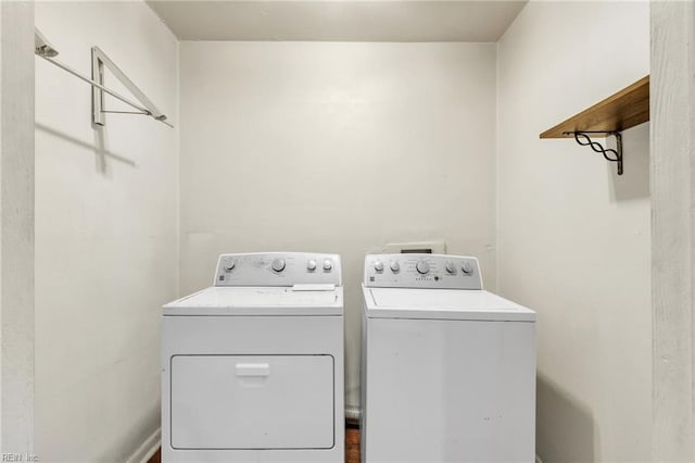 clothes washing area with laundry area and washer and clothes dryer