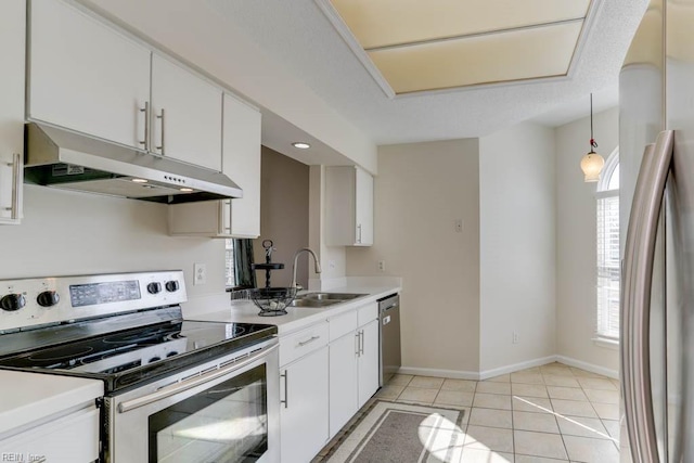 kitchen featuring light countertops, appliances with stainless steel finishes, white cabinets, a sink, and under cabinet range hood