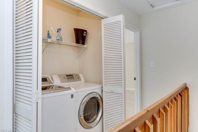 laundry area with laundry area and separate washer and dryer