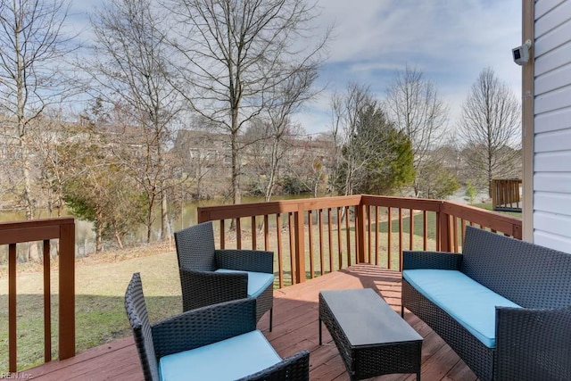 wooden terrace with an outdoor living space