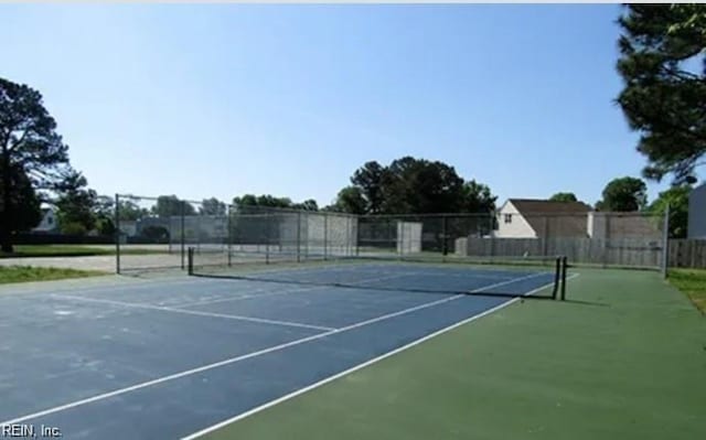 view of sport court with fence