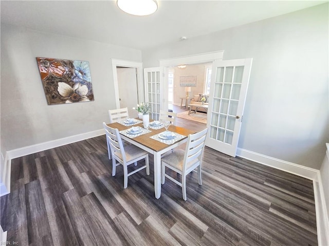 dining room featuring french doors, dark wood-type flooring, and baseboards