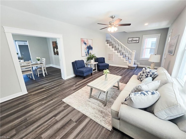 living room featuring baseboards, a ceiling fan, stairway, dark wood-type flooring, and recessed lighting