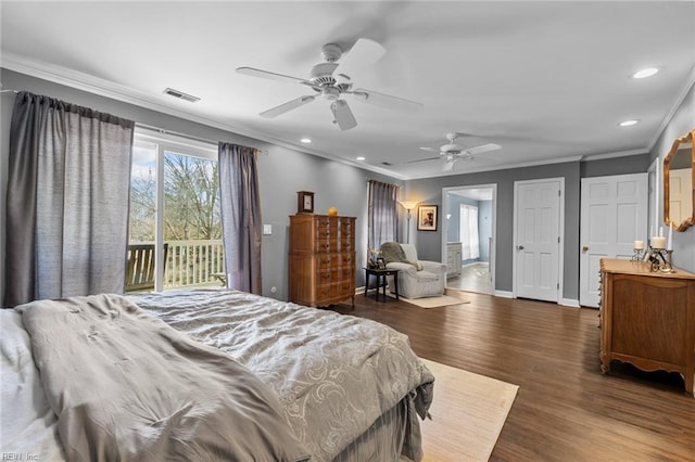 bedroom featuring dark wood-style flooring, visible vents, ornamental molding, access to outside, and baseboards