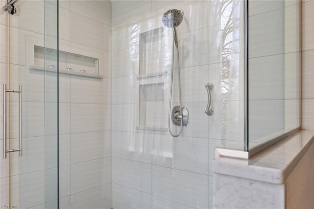 full bath featuring a tile shower