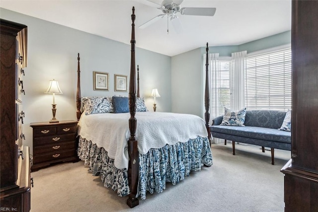 bedroom featuring light colored carpet and ceiling fan