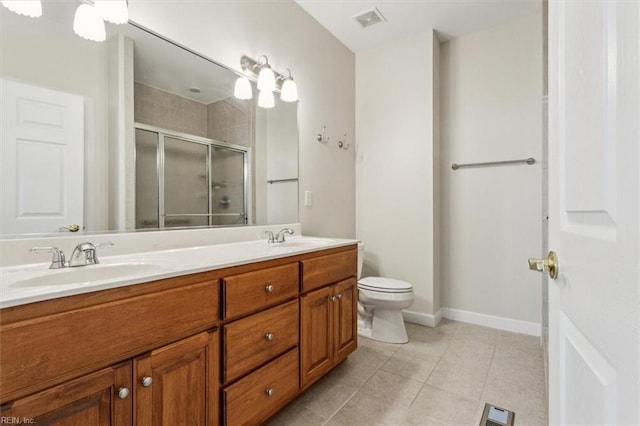 bathroom featuring a stall shower, visible vents, a sink, and tile patterned floors