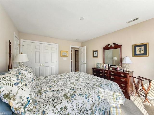 bedroom featuring a closet and visible vents