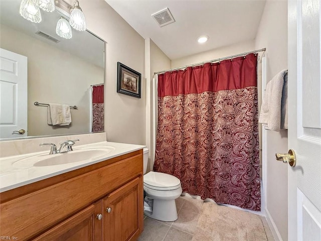 bathroom featuring toilet, tile patterned flooring, visible vents, and vanity