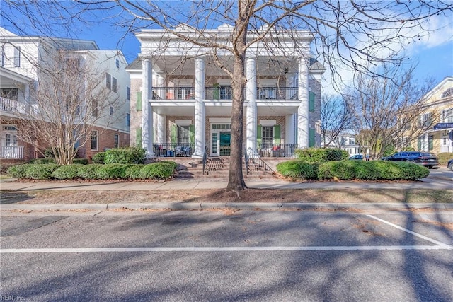 view of property featuring uncovered parking