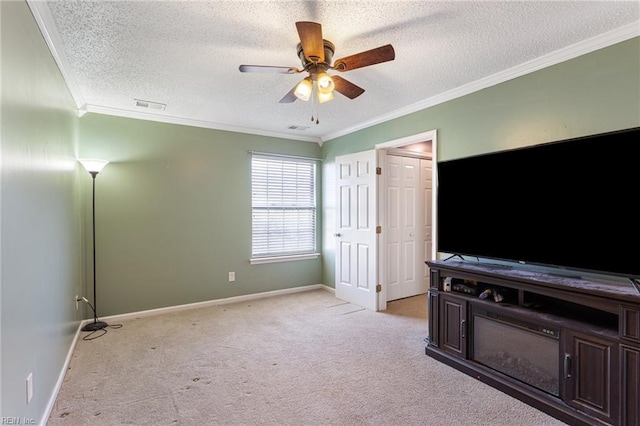 bedroom with crown molding, visible vents, light carpet, a textured ceiling, and baseboards