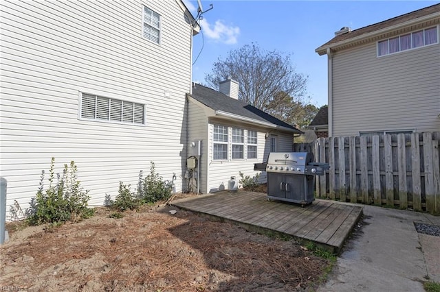 exterior space with grilling area and fence