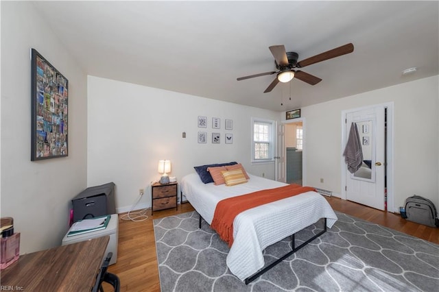 bedroom with wood finished floors and ceiling fan