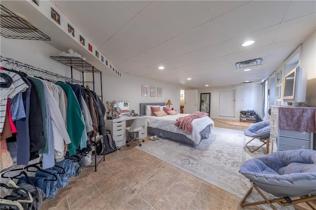 bedroom with visible vents, recessed lighting, and a paneled ceiling