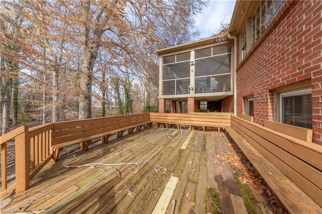 wooden terrace featuring a sunroom