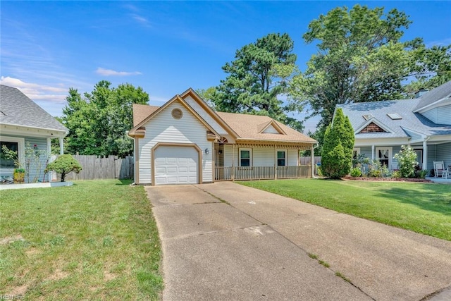 view of front of property with concrete driveway, covered porch, an attached garage, a front yard, and fence