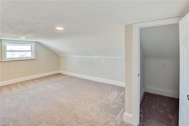 additional living space featuring carpet floors, lofted ceiling, baseboards, and recessed lighting