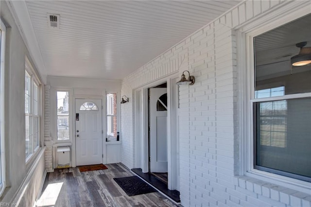 unfurnished sunroom with visible vents