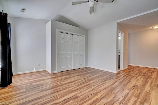 unfurnished bedroom with light wood finished floors, baseboards, and visible vents