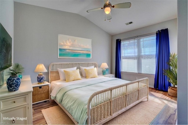 bedroom with lofted ceiling, light wood-style floors, ceiling fan, and visible vents