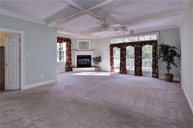 unfurnished living room with carpet floors, coffered ceiling, a glass covered fireplace, and baseboards