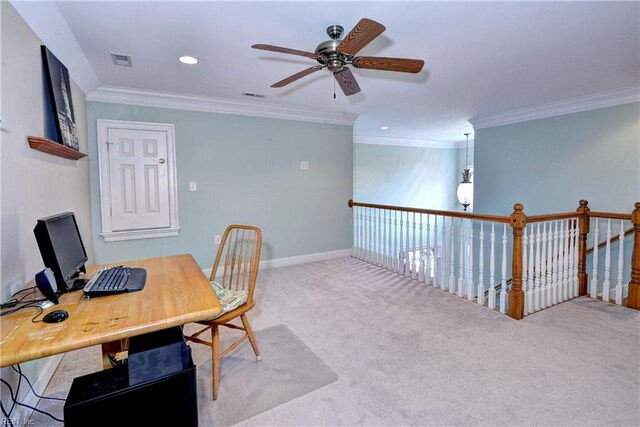 carpeted home office with visible vents, crown molding, and baseboards