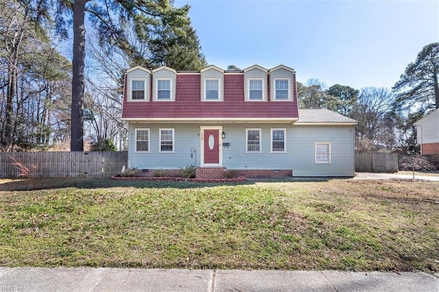 view of front facade with fence and a front yard