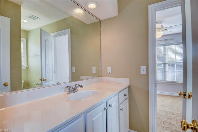 bathroom featuring recessed lighting, visible vents, toilet, vanity, and baseboards