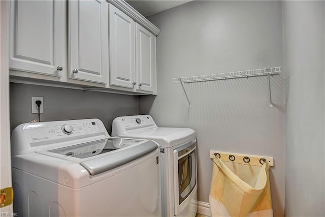 laundry room featuring cabinet space and independent washer and dryer