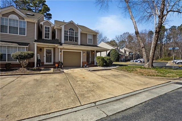 view of front of home with brick siding, driveway, and an attached garage