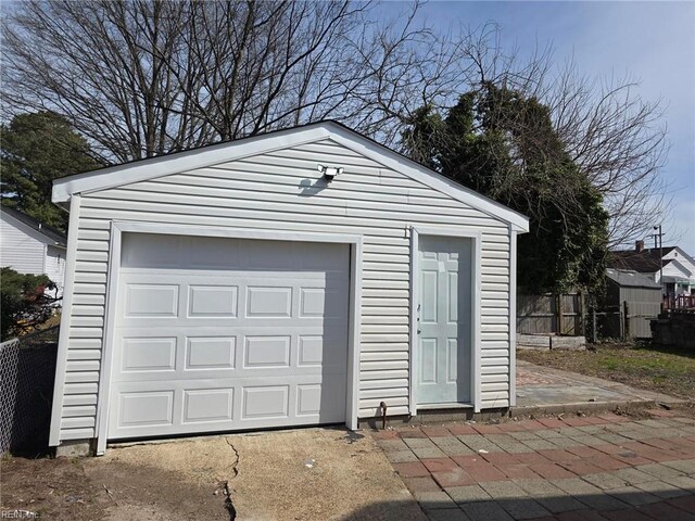 garage featuring fence