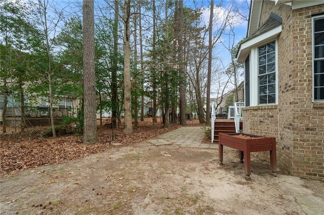 view of yard featuring a patio and fence