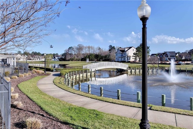 view of community with a water view