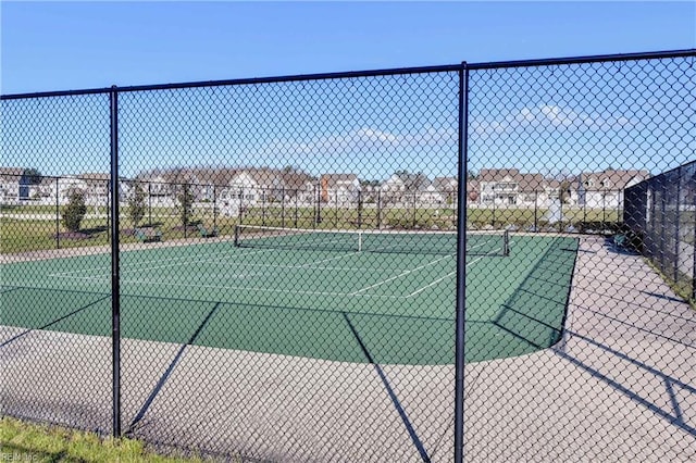 view of sport court with fence