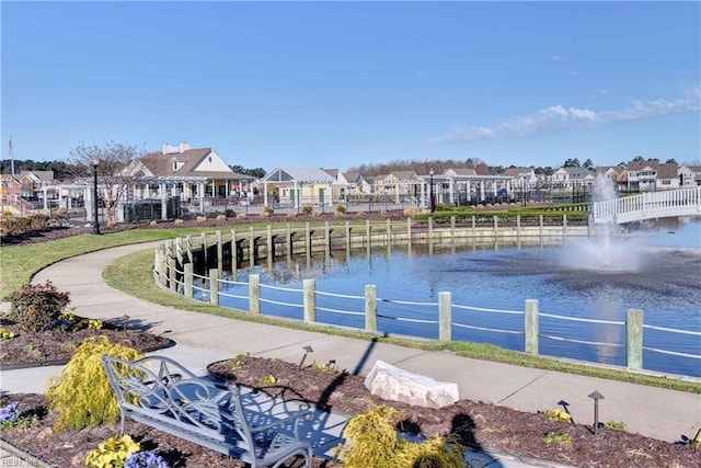 surrounding community with a residential view and a water view