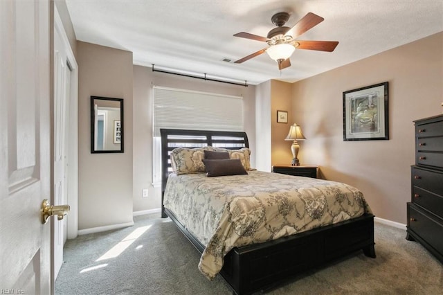 bedroom featuring a ceiling fan, carpet, visible vents, and baseboards