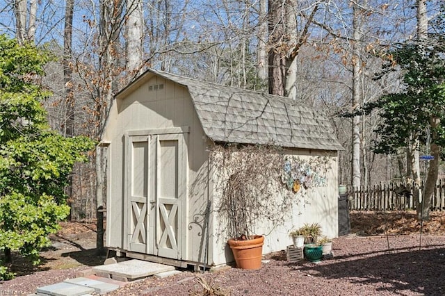 view of shed with fence