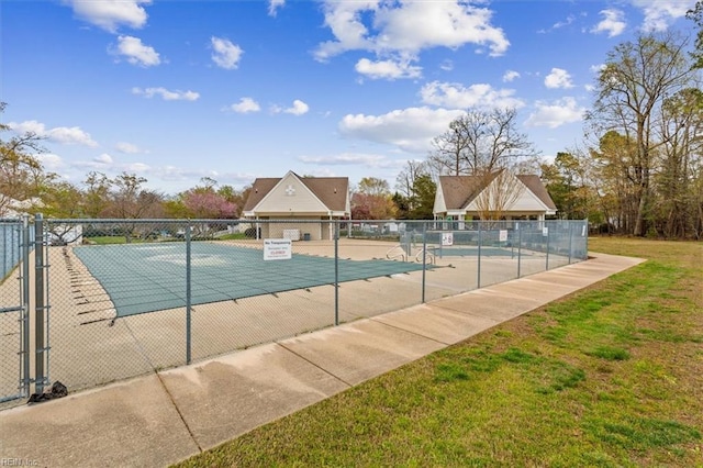 community pool featuring a yard, a patio area, and fence