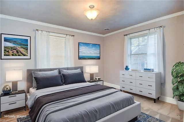 bedroom featuring baseboards and crown molding